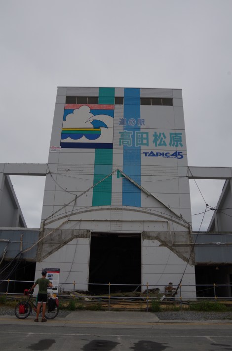 A tsunami evacuation tower, top left is the wave height. 3 people survived in here.